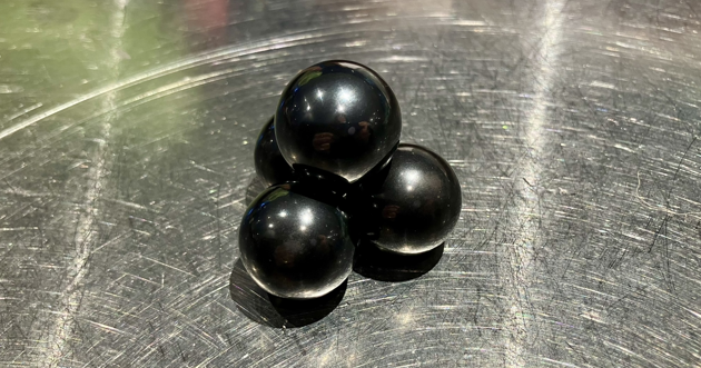 A tetrahedron made out of polished balls of hematite